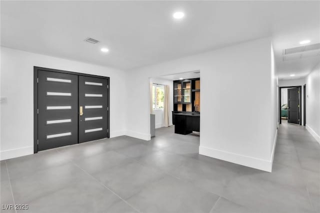 3189 Montecito Dr, Las Vegas, NV 89120 - entrance foyer featuring baseboards, recessed lighting, and concrete floors