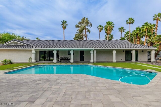 3189 Montecito Dr, Las Vegas, NV 89120 - outdoor pool featuring a patio and a yard