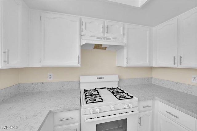 542 Grimsby Ave, Henderson, NV 89014 - kitchen with white gas range oven, under cabinet range hood, white cabinetry, and light stone counters
