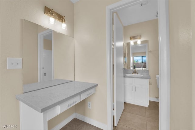 542 Grimsby Ave, Henderson, NV 89014 - bathroom featuring vanity, tile patterned floors, baseboards, and toilet