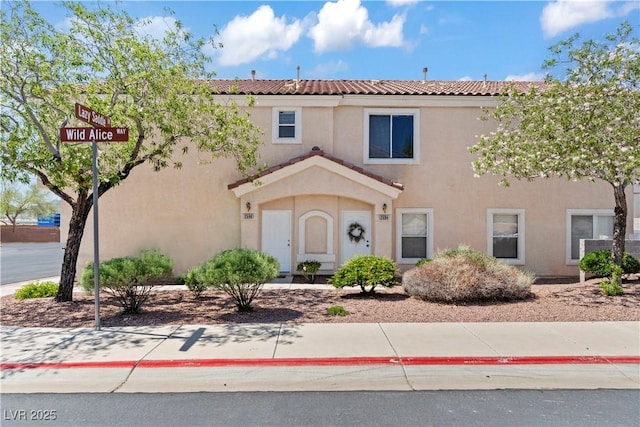 2596 Lazy Saddle Dr, Henderson, NV 89002 - view of front of house with stucco siding and a tiled roof