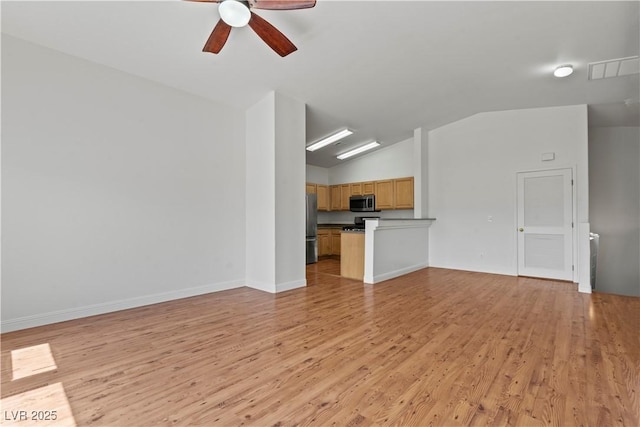 2596 Lazy Saddle Dr, Henderson, NV 89002 - unfurnished living room with vaulted ceiling, light wood-type flooring, ceiling fan, and baseboards