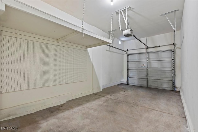 2596 Lazy Saddle Dr, Henderson, NV 89002 - garage with a garage door opener and baseboards