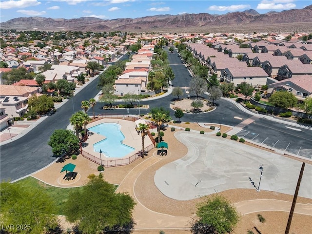 2596 Lazy Saddle Dr, Henderson, NV 89002 - aerial view of property and surrounding area featuring nearby suburban area, a pool area, and mountains