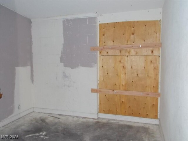 1912 Statz St, North Las Vegas, NV 89030 - unfurnished room with unfinished concrete floors and baseboards