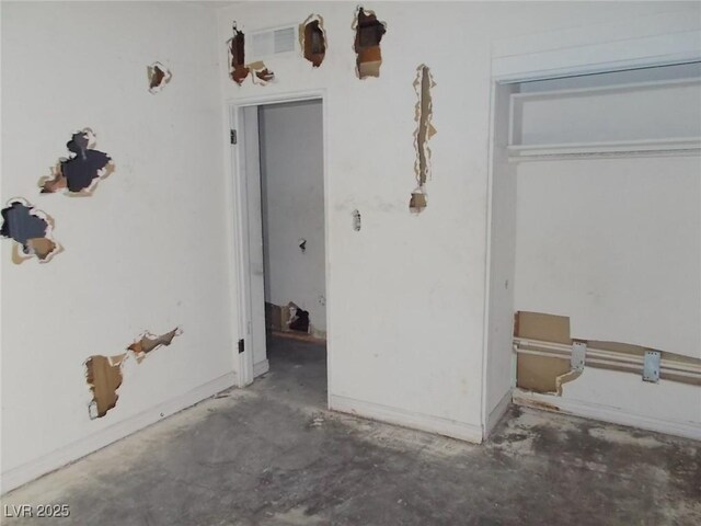 1912 Statz St, North Las Vegas, NV 89030 - unfurnished bedroom featuring unfinished concrete flooring and a closet