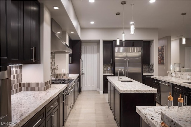 1683 Tangiers Dr, Henderson, NV 89012 - kitchen with appliances with stainless steel finishes, a sink, wall chimney exhaust hood, backsplash, and a kitchen island with sink