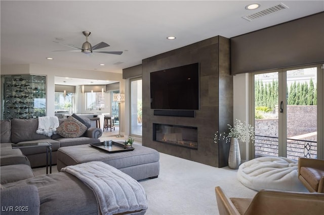 1683 Tangiers Dr, Henderson, NV 89012 - carpeted living room with ceiling fan, recessed lighting, and a large fireplace