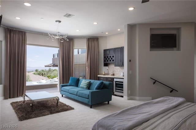 1683 Tangiers Dr, Henderson, NV 89012 - bedroom with beverage cooler, a chandelier, wet bar, light colored carpet, and recessed lighting