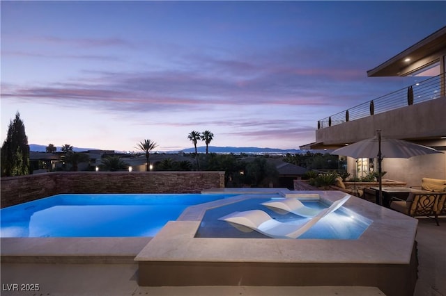 1683 Tangiers Dr, Henderson, NV 89012 - pool at dusk with a pool with connected hot tub