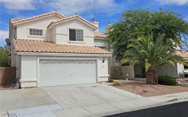 3750 Morning Canyon St, Las Vegas, NV 89147 - mediterranean / spanish-style house featuring concrete driveway, a garage, and stucco siding