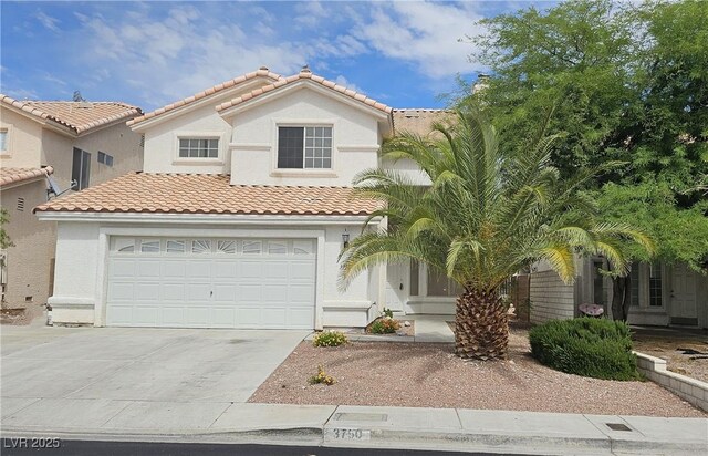 3750 Morning Canyon St, Las Vegas, NV 89147 - mediterranean / spanish home with driveway, a tiled roof, stucco siding, and a garage
