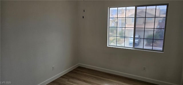 3750 Morning Canyon St, Las Vegas, NV 89147 - empty room with baseboards, plenty of natural light, and wood finished floors