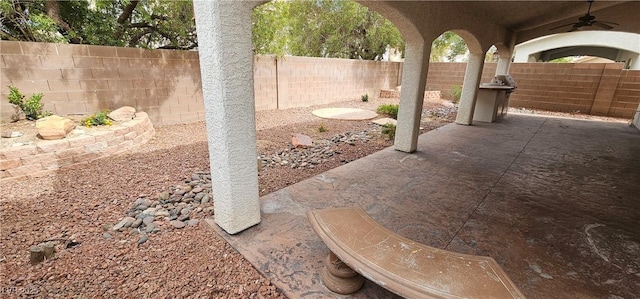 3750 Morning Canyon St, Las Vegas, NV 89147 - fenced backyard with ceiling fan and a patio area