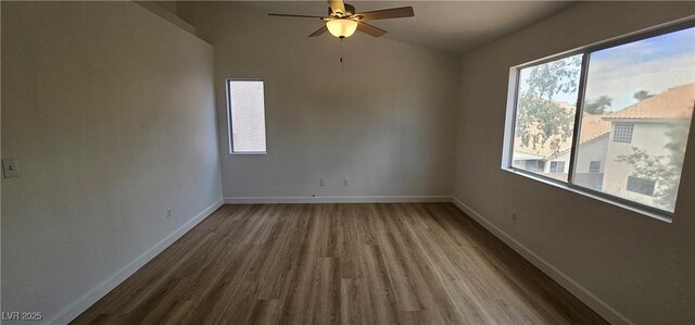 3750 Morning Canyon St, Las Vegas, NV 89147 - empty room featuring wood finished floors, a ceiling fan, baseboards, and lofted ceiling
