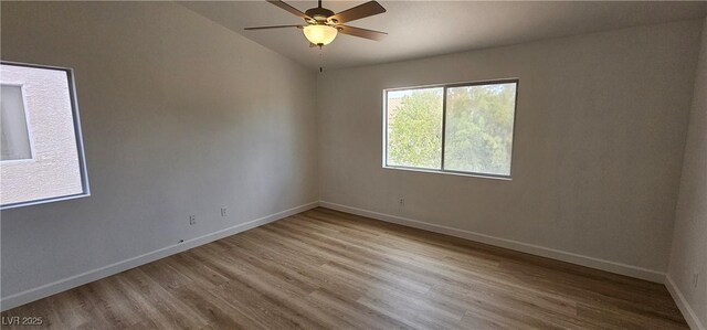3750 Morning Canyon St, Las Vegas, NV 89147 - spare room featuring wood finished floors, baseboards, ceiling fan, and lofted ceiling