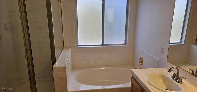 3750 Morning Canyon St, Las Vegas, NV 89147 - full bathroom with a bath, a shower stall, vanity, and a textured wall