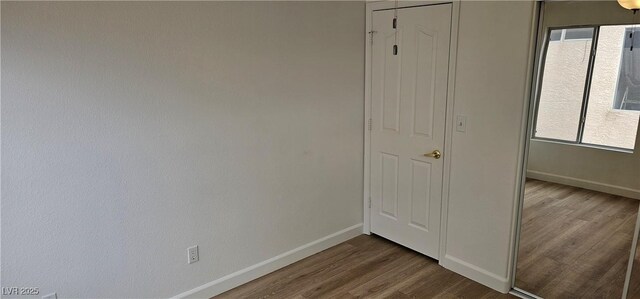 3750 Morning Canyon St, Las Vegas, NV 89147 - unfurnished bedroom with dark wood-type flooring and baseboards