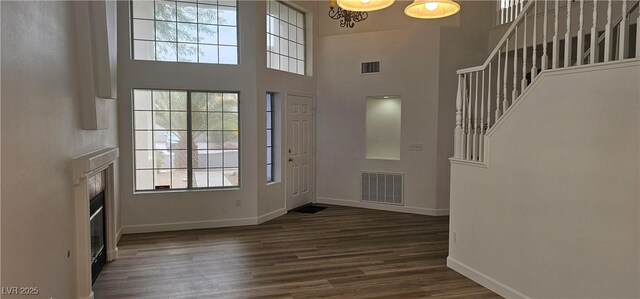 3750 Morning Canyon St, Las Vegas, NV 89147 - foyer entrance featuring baseboards, stairs, plenty of natural light, wood finished floors, and a high ceiling
