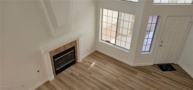 3750 Morning Canyon St, Las Vegas, NV 89147 - foyer entrance with light wood-style floors, baseboards, and a tiled fireplace