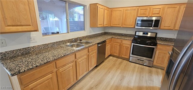 3750 Morning Canyon St, Las Vegas, NV 89147 - kitchen featuring appliances with stainless steel finishes, light wood-type flooring, a sink, and light brown cabinetry