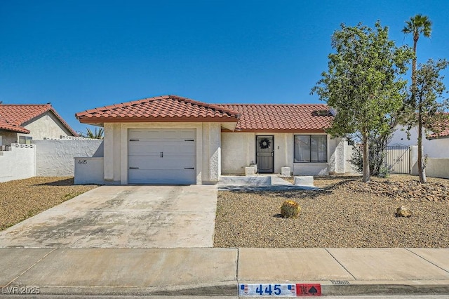445 Concord Way, Henderson, NV 89015 - mediterranean / spanish-style house with a tile roof, stucco siding, a garage, and driveway