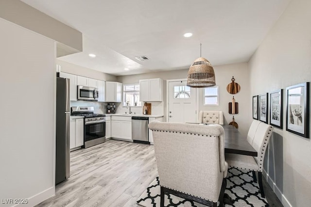 445 Concord Way, Henderson, NV 89015 - dining area featuring light wood-style floors, recessed lighting, and baseboards