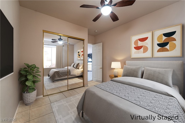 5210 Villa Dante Ave, Las Vegas, NV 89141 - tiled bedroom featuring a closet, baseboards, and a ceiling fan