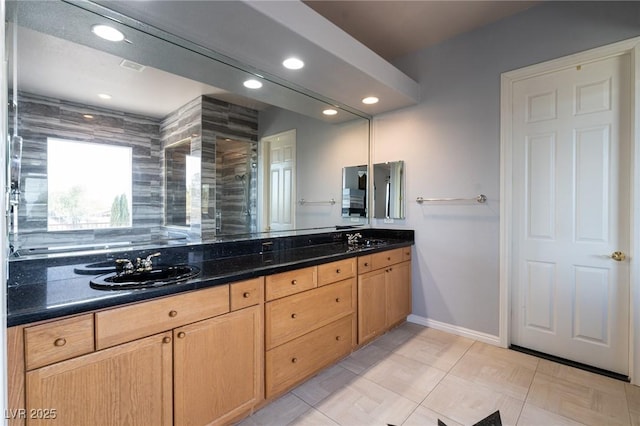 5210 Villa Dante Ave, Las Vegas, NV 89141 - full bathroom with a shower stall, double vanity, recessed lighting, and baseboards