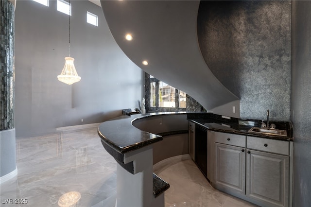 5210 Villa Dante Ave, Las Vegas, NV 89141 - kitchen with a sink, light marble finish floors, plenty of natural light, recessed lighting, and a towering ceiling
