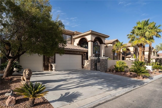 5210 Villa Dante Ave, Las Vegas, NV 89141 - mediterranean / spanish home featuring stucco siding, concrete driveway, stone siding, a tile roof, and a garage