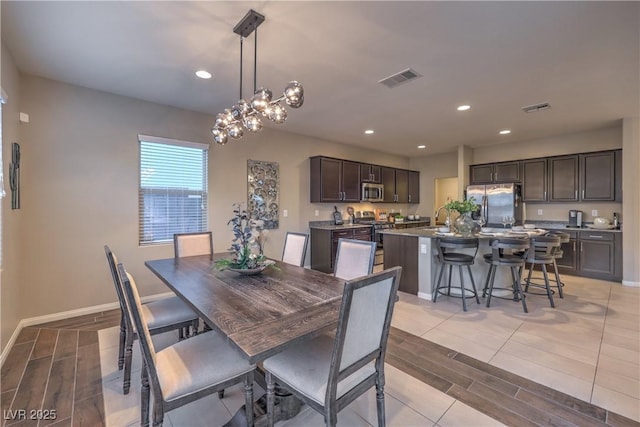 3213 Molinos Dr, Las Vegas, NV 89141 - dining area featuring wood tiled floors, a chandelier, recessed lighting, and baseboards