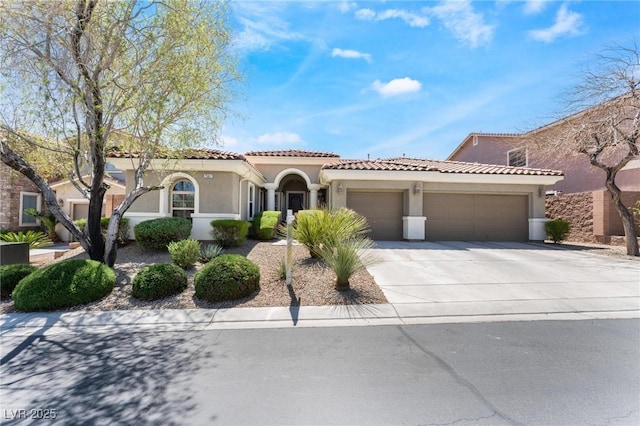 7567 Desertscape Ave, Las Vegas, NV 89178 - mediterranean / spanish house with a garage, stucco siding, concrete driveway, and a tile roof