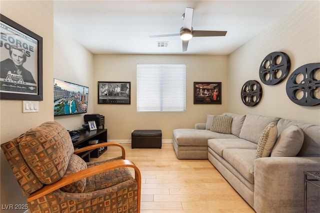 7567 Desertscape Ave, Las Vegas, NV 89178 - living area with wood finished floors, a ceiling fan, and baseboards