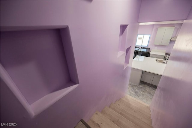 2807 Hermosa St, Las Vegas, NV 89169 - stairway featuring wood finished floors
