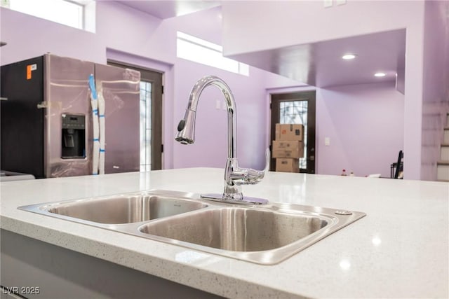 2807 Hermosa St, Las Vegas, NV 89169 - kitchen view of stainless steel fridge and a sink
