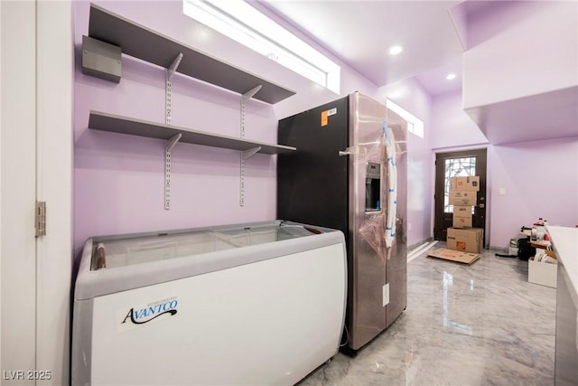 2807 Hermosa St, Las Vegas, NV 89169 - washroom with washer and clothes dryer, recessed lighting, and light marble finish flooring