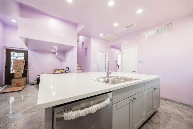 2807 Hermosa St, Las Vegas, NV 89169 - kitchen with a sink, stainless steel dishwasher, a center island with sink, recessed lighting, and gray cabinets