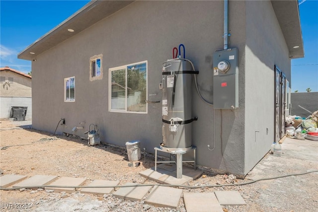 2807 Hermosa St, Las Vegas, NV 89169 - view of home's exterior with secured water heater and stucco siding