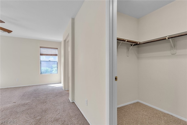 10791 Silver Lace Ln, Las Vegas, NV 89135 - spacious closet featuring carpet floors and ceiling fan