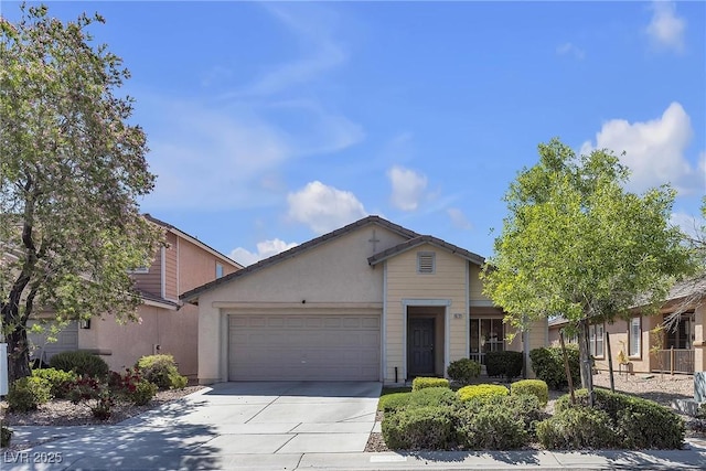 10791 Silver Lace Ln, Las Vegas, NV 89135 - view of front of home featuring an attached garage, driveway, and stucco siding