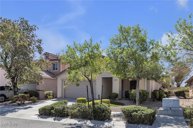 10791 Silver Lace Ln, Las Vegas, NV 89135 - obstructed view of property with a garage, concrete driveway, and stucco siding