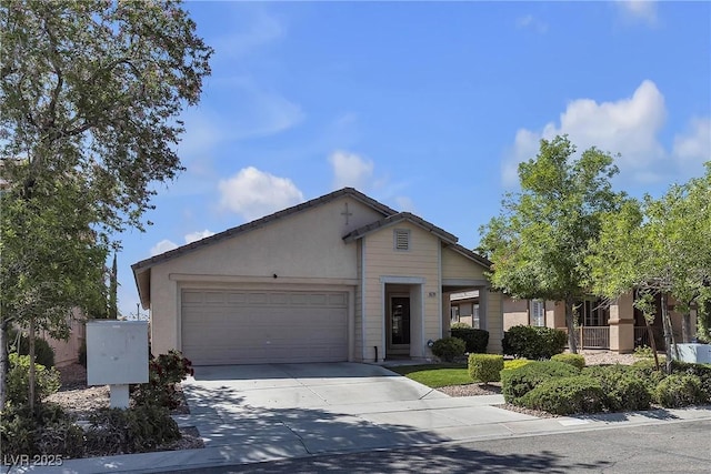 10791 Silver Lace Ln, Las Vegas, NV 89135 - view of front facade featuring concrete driveway, an attached garage, and stucco siding