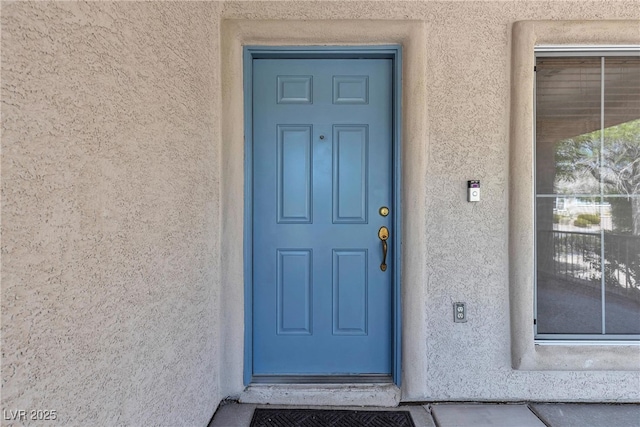 10791 Silver Lace Ln, Las Vegas, NV 89135 - view of exterior entry with stucco siding