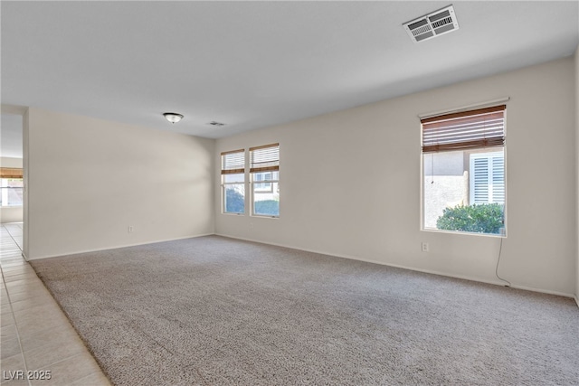 10791 Silver Lace Ln, Las Vegas, NV 89135 - unfurnished room featuring baseboards, light colored carpet, and light tile patterned floors
