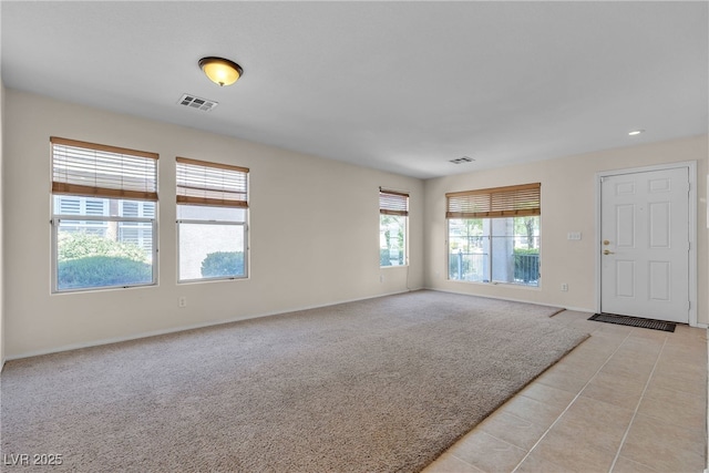 10791 Silver Lace Ln, Las Vegas, NV 89135 - unfurnished room featuring baseboards, recessed lighting, light colored carpet, and light tile patterned floors