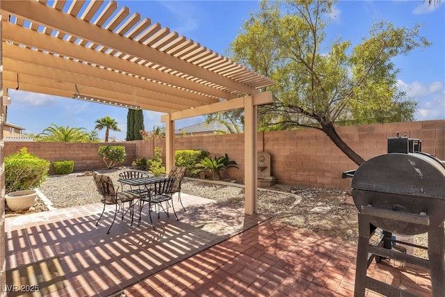 10791 Silver Lace Ln, Las Vegas, NV 89135 - fenced backyard with outdoor dining area, a pergola, a patio area, and a grill