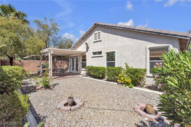 10791 Silver Lace Ln, Las Vegas, NV 89135 - back of property featuring a pergola, stucco siding, and a patio area