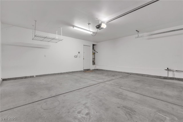 10791 Silver Lace Ln, Las Vegas, NV 89135 - garage with baseboards and a garage door opener