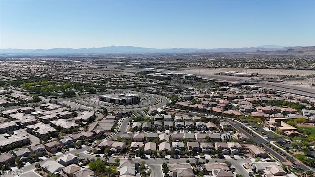 10791 Silver Lace Ln, Las Vegas, NV 89135 - aerial overview of property's location with a mountain backdrop and nearby suburban area